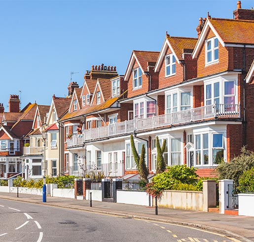 photo of a sunny street of terraced houses