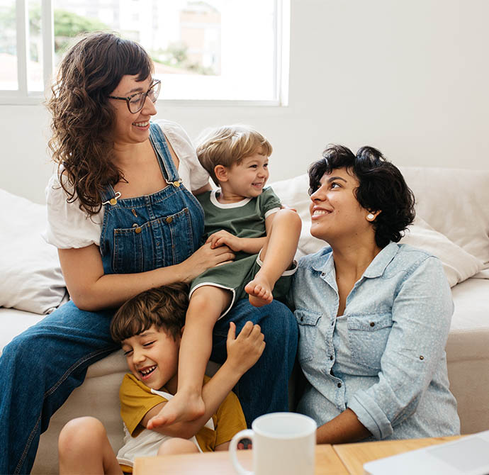two women and a baby sitting together